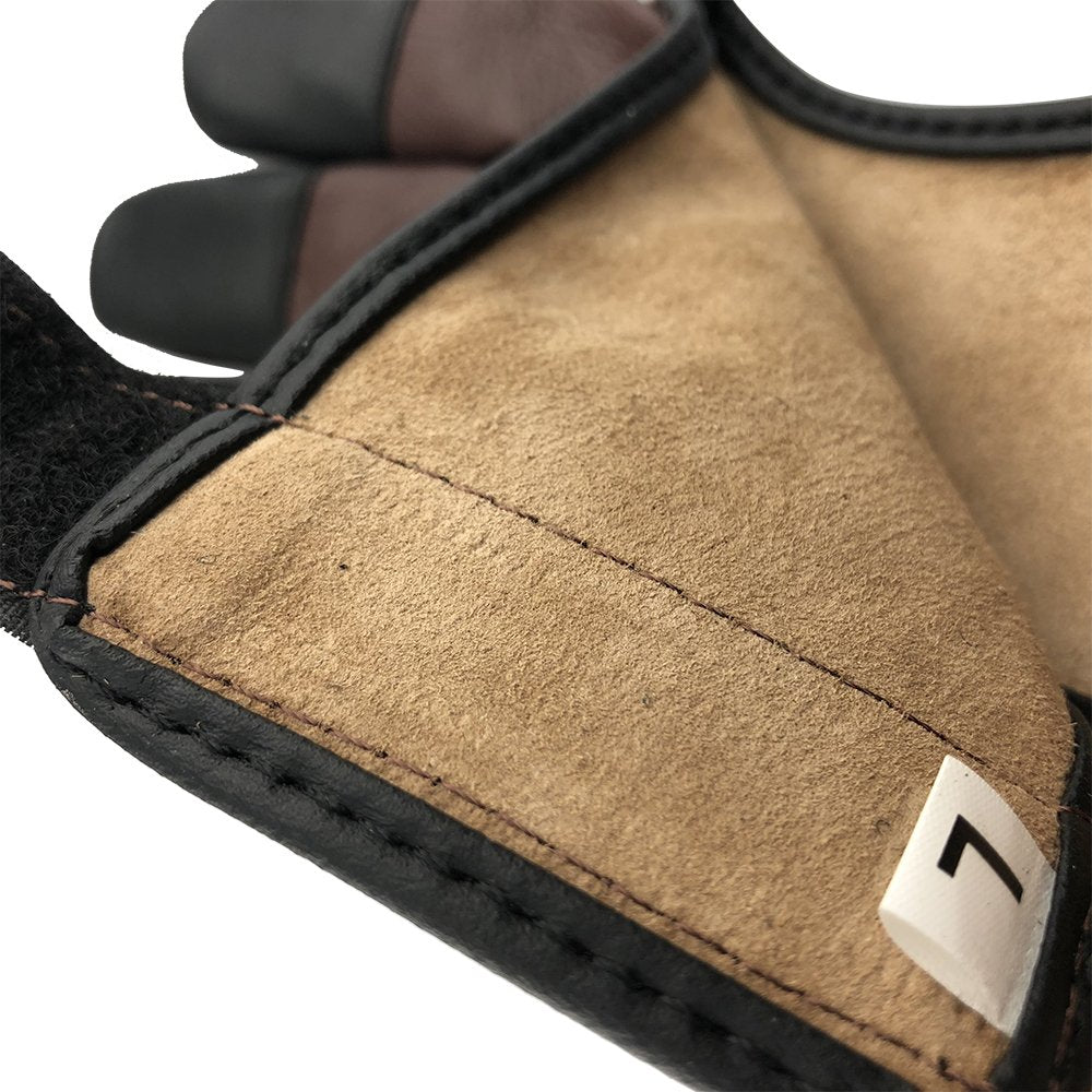 Close-up of cow leather finger protection on archery glove